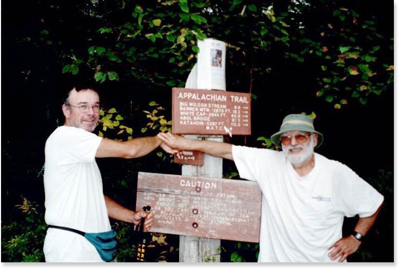 30.4 MM. These are the trail signs at the ME 15 parking lot for the AT northbound going into the Hundred Mile Wilderness. Hopefully they replace the CAUTION sign as it is totally unreadable.  Chris Connolly and Dean Gletsos are photographed here. Courtesy askus3@optonline.net